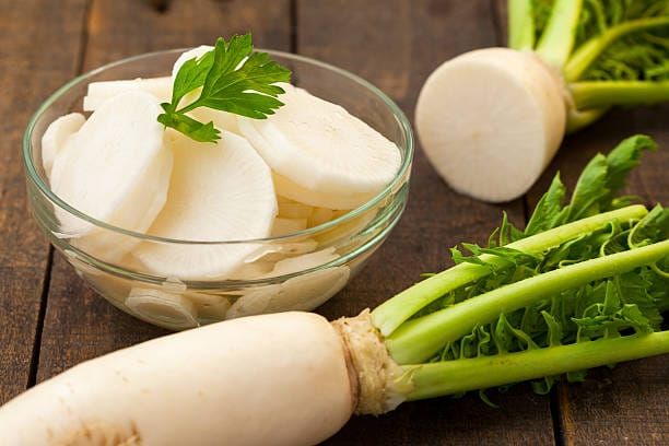 White daikon radish on rustic wooden table Radish